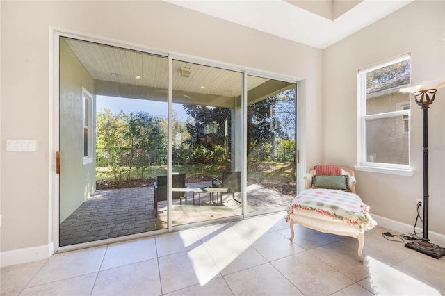 doorway to outside featuring light tile patterned flooring