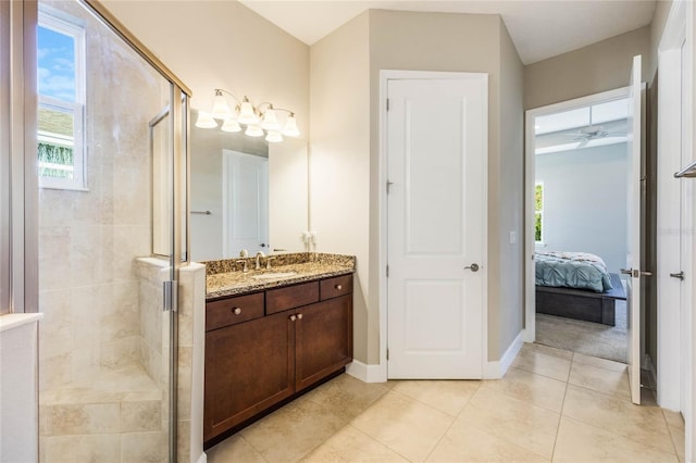 bathroom with vanity, tile patterned floors, and a shower with shower door