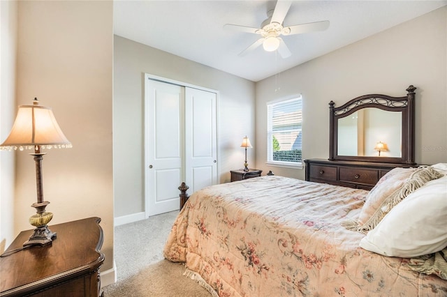 bedroom featuring ceiling fan, a closet, and carpet