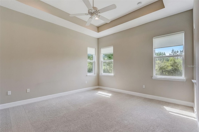 430 Cypress Hills Way, Deland, FL 32724 - carpeted empty room featuring baseboards, ceiling fan, and a tray ceiling