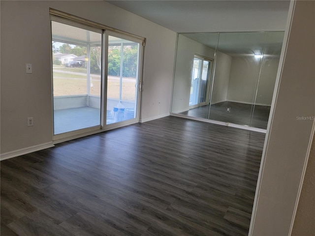 spare room featuring dark hardwood / wood-style flooring