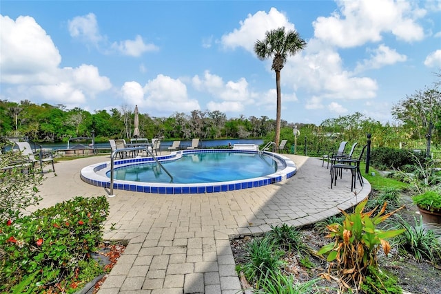 view of swimming pool with a patio area