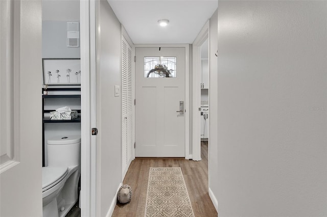 doorway to outside with light hardwood / wood-style floors