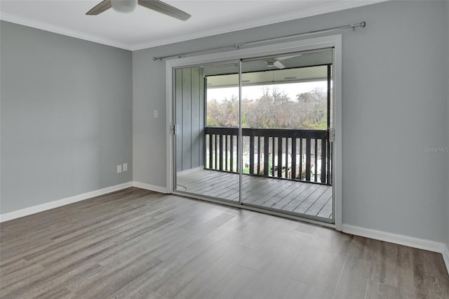 unfurnished room featuring ceiling fan, hardwood / wood-style floors, and ornamental molding