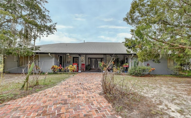 view of front of house with a garage and a porch