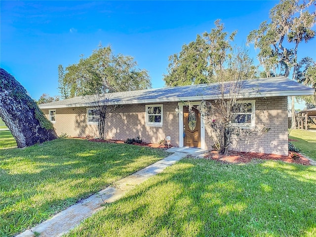 ranch-style house with a front yard