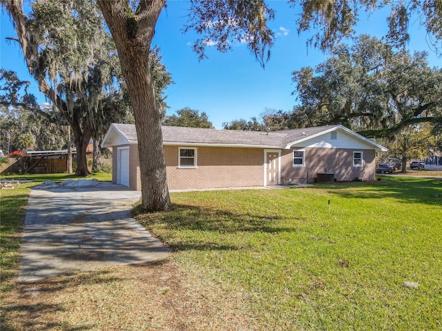 single story home featuring a front yard and central AC