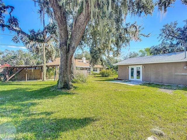 view of yard with french doors