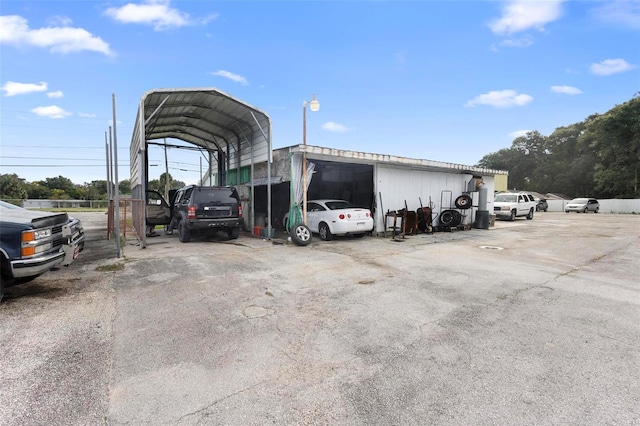 view of parking / parking lot with a carport