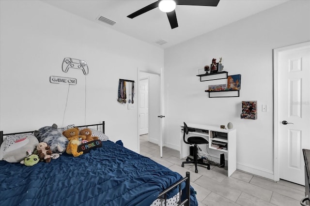 bedroom with ceiling fan and light tile patterned flooring