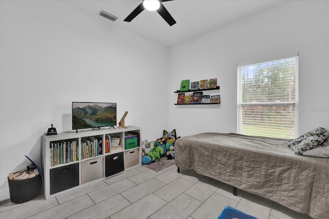 bedroom featuring ceiling fan and light tile patterned floors