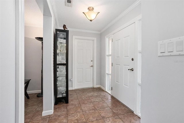 foyer featuring ornamental molding