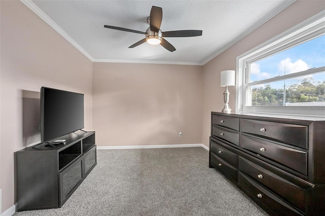 interior space featuring light carpet, a textured ceiling, ceiling fan, and ornamental molding