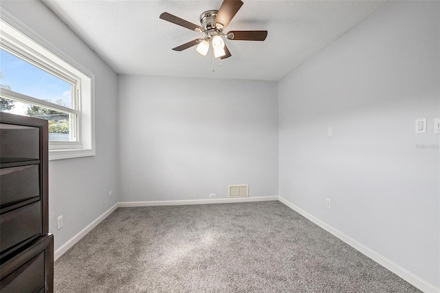 empty room featuring ceiling fan