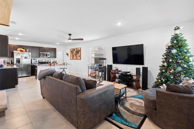 tiled living room featuring ceiling fan