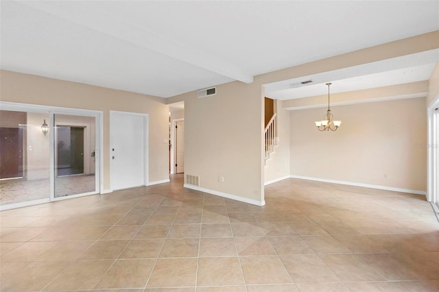 tiled empty room featuring a chandelier and beamed ceiling