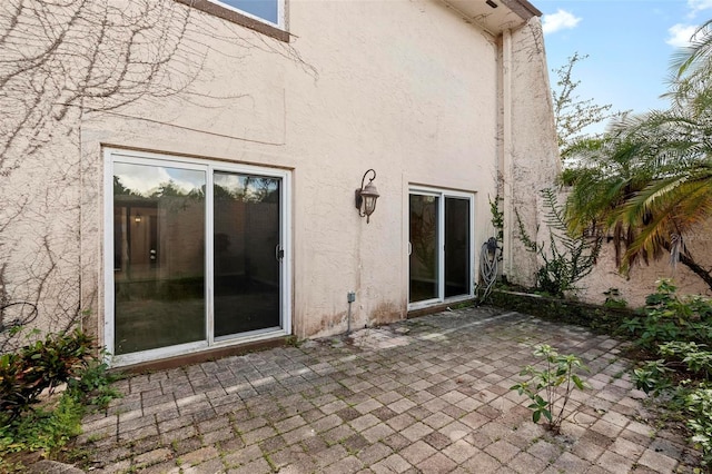 rear view of house featuring a patio