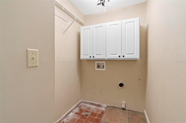 laundry room featuring cabinets, washer hookup, and electric dryer hookup