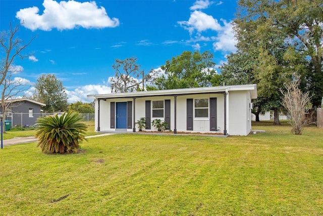 ranch-style home with a front lawn