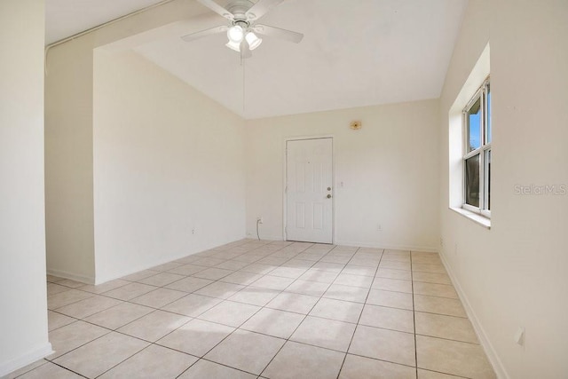 tiled empty room featuring ceiling fan