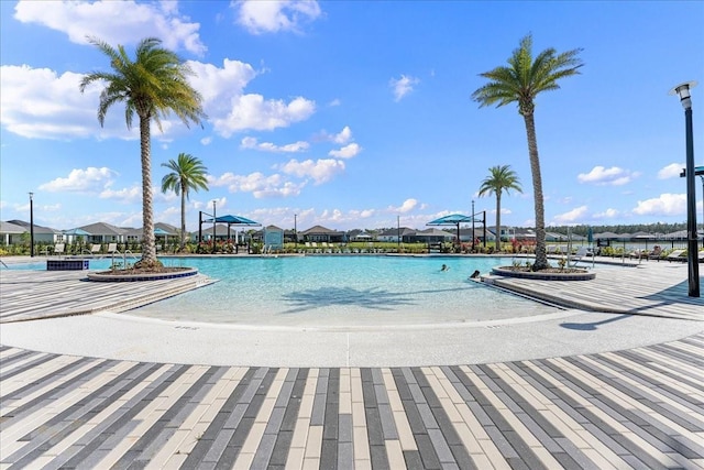 view of pool with a water view