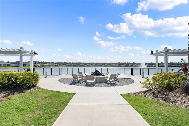 exterior space with a pergola and a water view