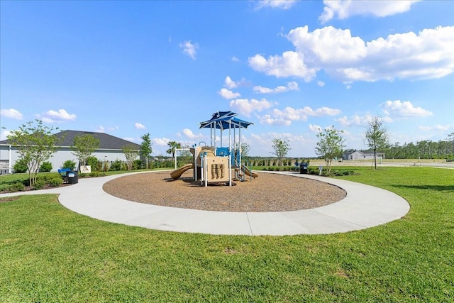 view of play area featuring a lawn