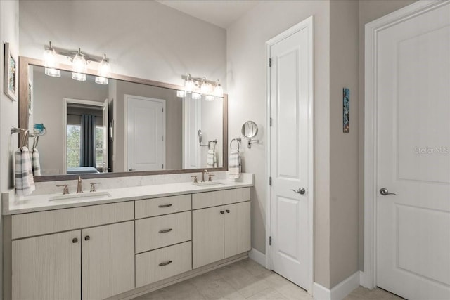 bathroom with tile patterned flooring and vanity