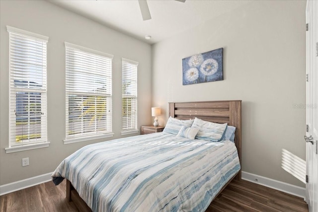 bedroom featuring ceiling fan and dark wood-type flooring