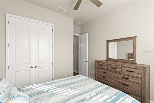 bedroom with ceiling fan and a closet