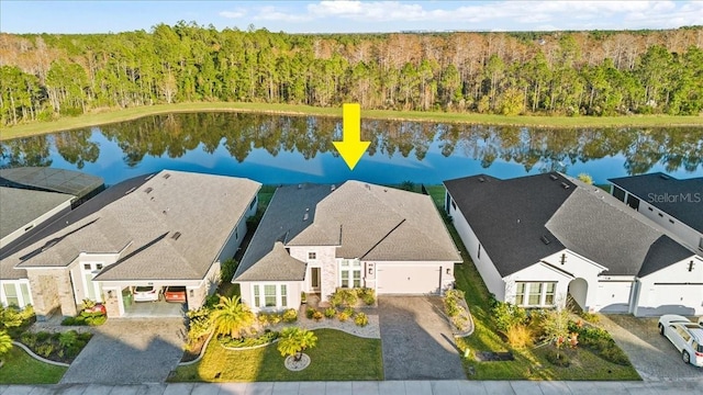 birds eye view of property featuring a water view