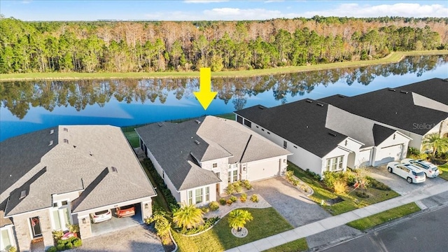 birds eye view of property with a water view