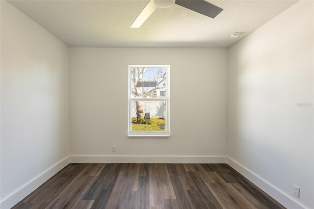 unfurnished room with dark hardwood / wood-style floors and ceiling fan