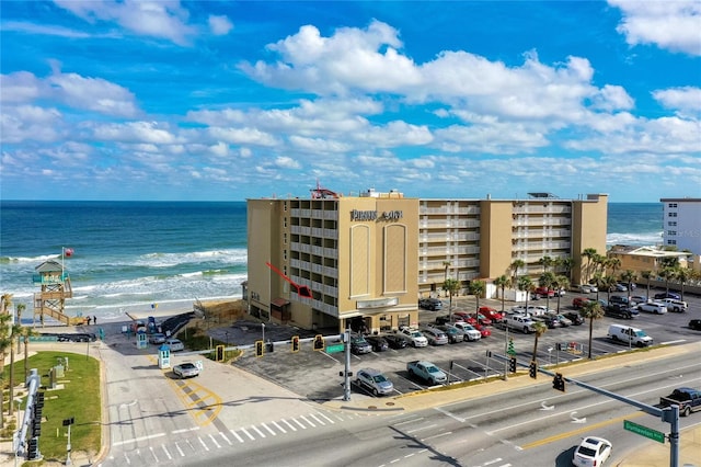 exterior space with a beach view and a water view