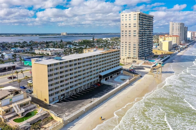 aerial view featuring a water view and a beach view