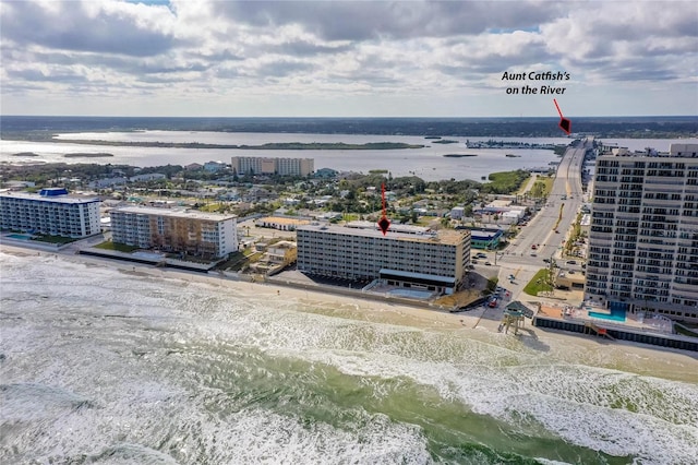 bird's eye view with a view of the beach and a water view