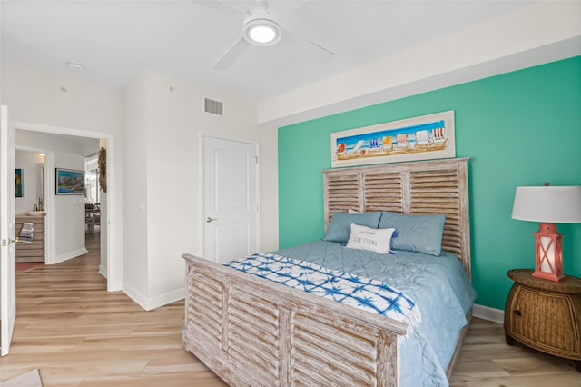 bedroom featuring ceiling fan and light wood-type flooring