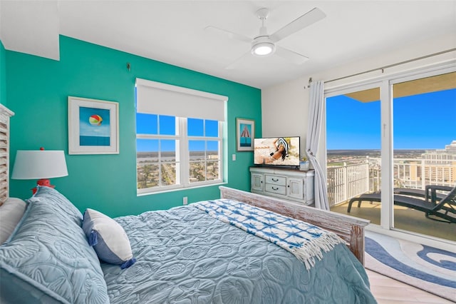 bedroom featuring access to exterior and ceiling fan