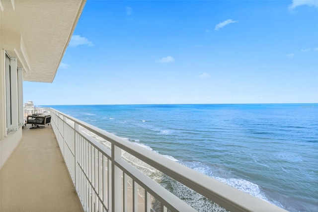 balcony featuring a water view