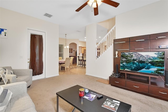 living room with ceiling fan and light carpet