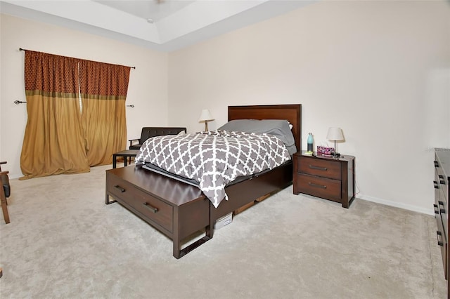 bedroom with light colored carpet