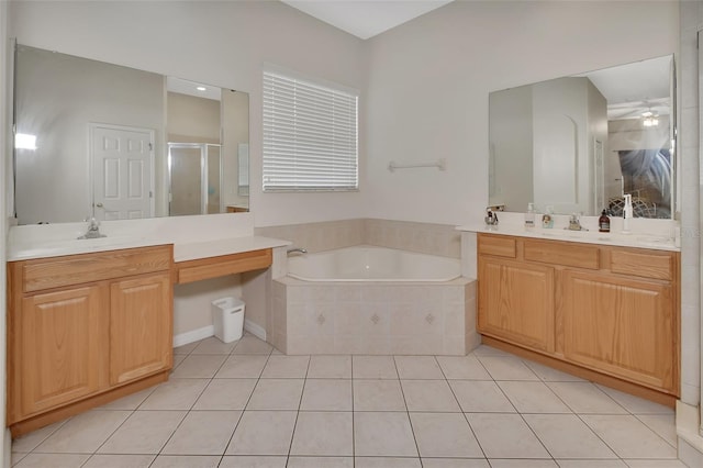 bathroom with tile patterned flooring, vanity, and separate shower and tub