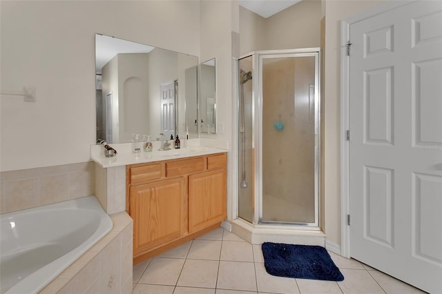 bathroom featuring vanity, tile patterned floors, and independent shower and bath