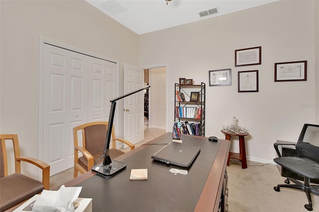 office area featuring light colored carpet