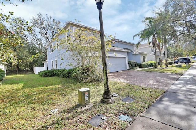 view of side of home with a yard