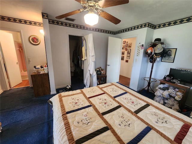 bedroom featuring a closet, a spacious closet, and ceiling fan