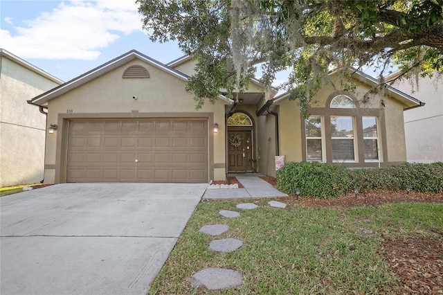 view of front of home with a garage