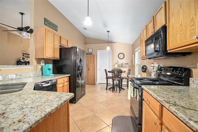 kitchen with vaulted ceiling, ceiling fan, sink, black appliances, and pendant lighting