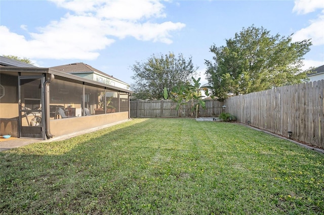 view of yard featuring a sunroom