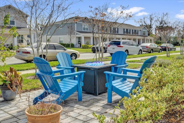 exterior space with a patio area, a residential view, and a fire pit